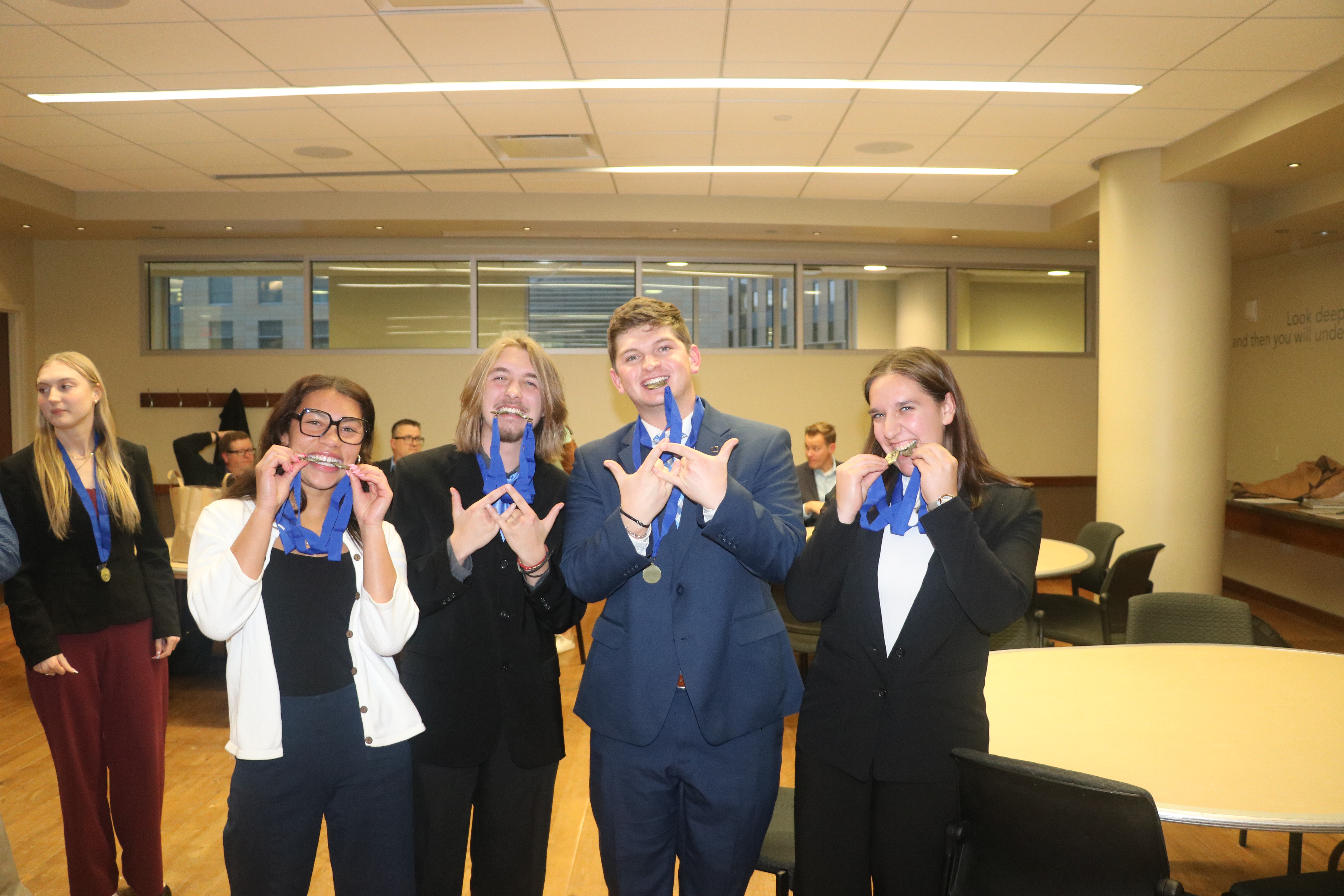 Team celebrating with medals after winning competition